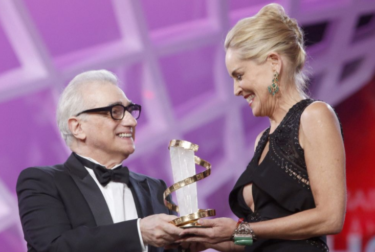 Sharon Stone receives a trophy in tribute to her lifetime career, from American film director Martin Scorsese