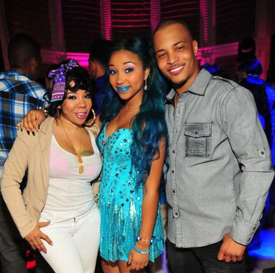 Zonnique Pullins with her stepfater T. I and her mother Tiny