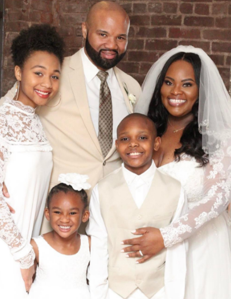 Tasha Cobbs with her husband and children