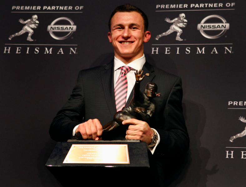 Johnny Manziel with Heisman Trophy