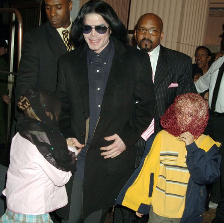 Michael Jackson walks with his children, Prince and Paris in 2005