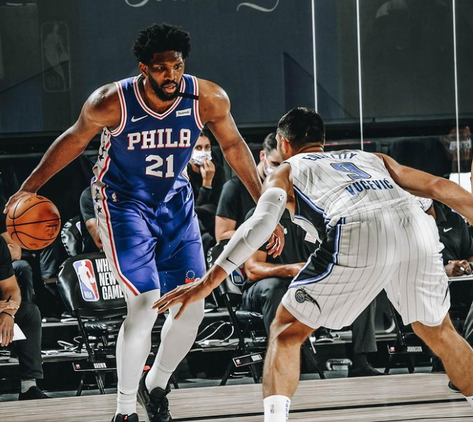 Joel Embiid with the ball against the opponent