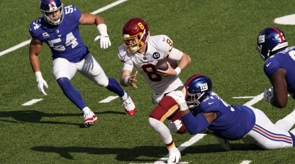 Kyle Allen heading the ball against the opponent