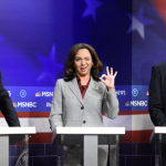 Maya Rudolph as Kamala Harris with Larry David, left, as Bernie Sanders  and Will Ferrell as Tom Steyer during a Democratic debate sketch on SNL