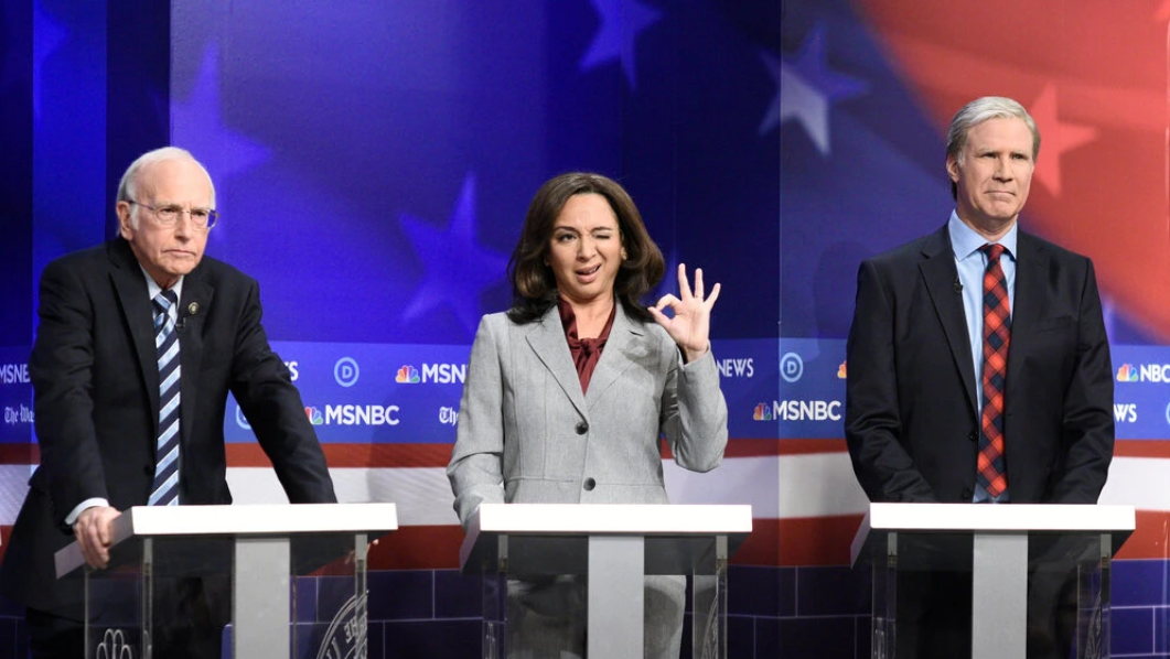 Maya Rudolph as Kamala Harris with Larry David, left, as Bernie Sanders  and Will Ferrell as Tom Steyer during a Democratic debate sketch on SNL