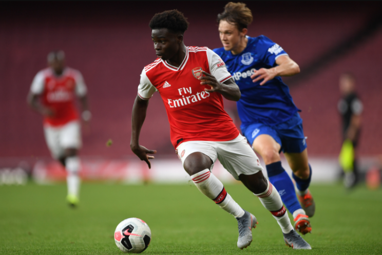 Bukayo Saka Heading The Ball Against The Opponent