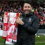 Danny Cowley celebrates with the League Two trophy during his time as Lincoln City boss