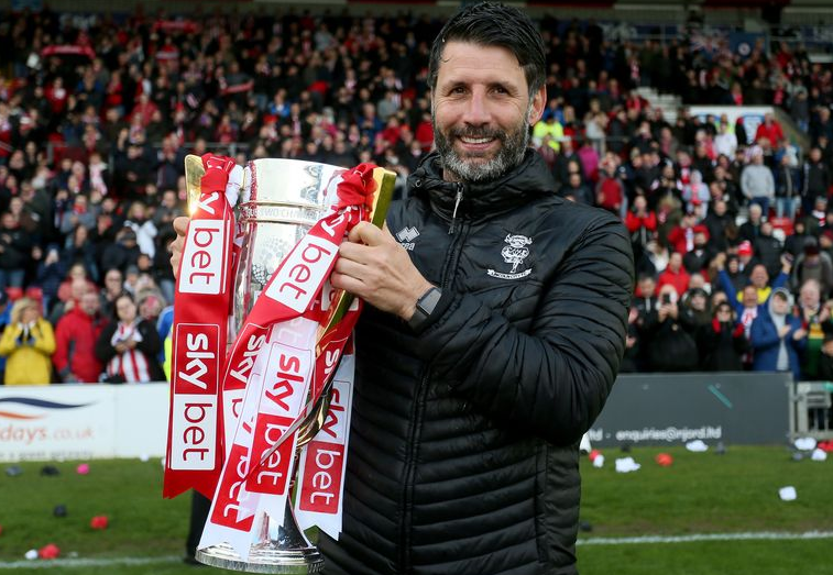 Danny Cowley celebrates with the League Two trophy during his time as Lincoln City boss