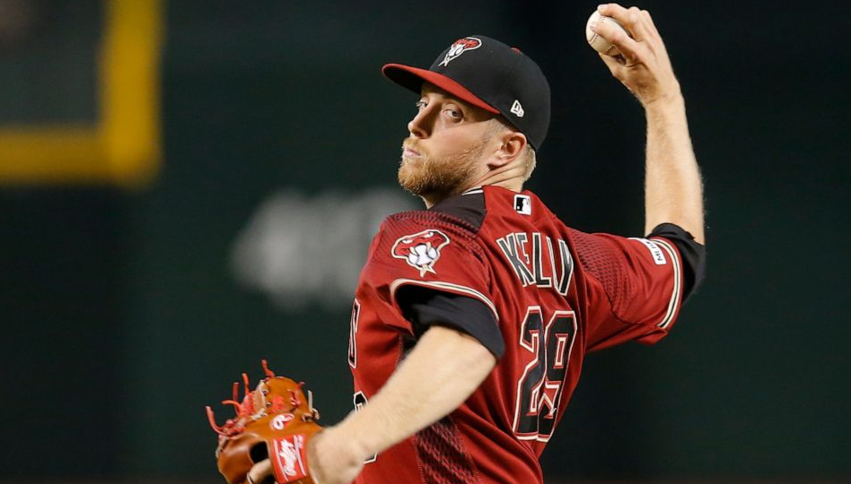 Merrill Kelly throws in the first inning during a baseball game against the New York Mets