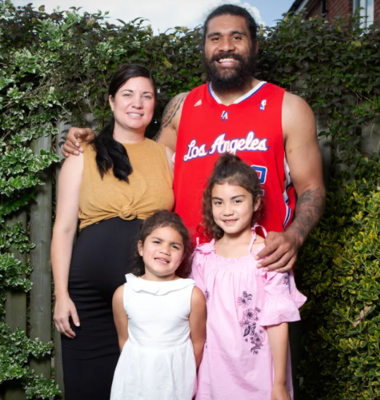 Mose Masoe with his wife, Carissa and their kids