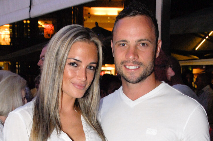 Oscar Pistorius posing next to his girlfriend Reeva Steenkamp