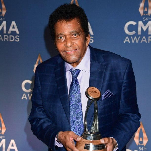 Charley Pride with award