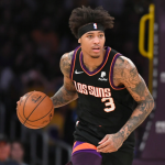Kelly Oubre Jr. heading the ball