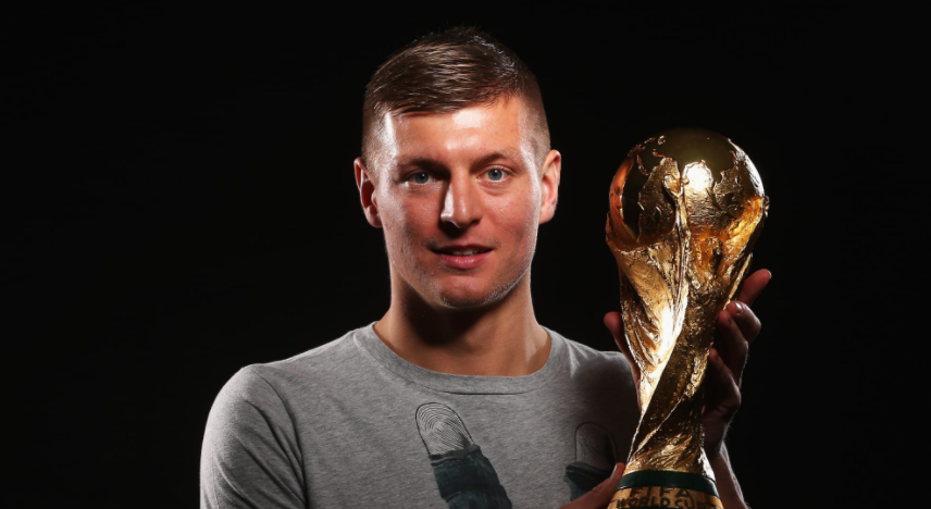 Toni Kroos Holding World Cup Trophy