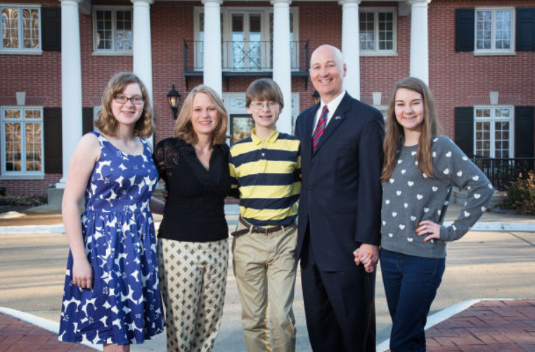 Pete Ricketts with his wife and their kids