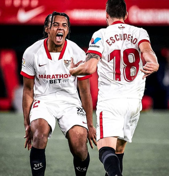 Jules Kounda Shouting After A Goal alonside, Sergio Escudero (defender)