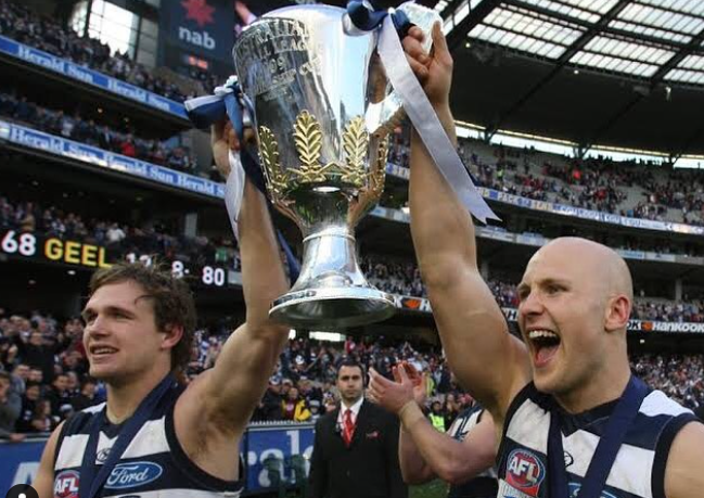 Gary Ablett Jr. Holding the Trophy with his team mate, Joel Selwood