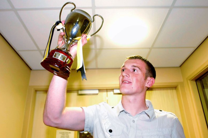 Lee Collins Holding The Trophy