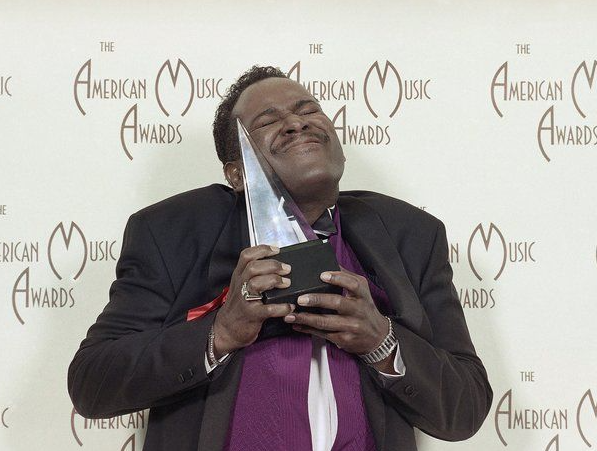 Luther Vandross with award