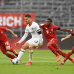 Andre Silva heading the ball against the opponent