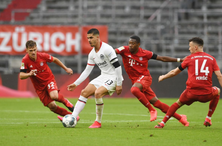 Andre Silva heading the ball against the opponent